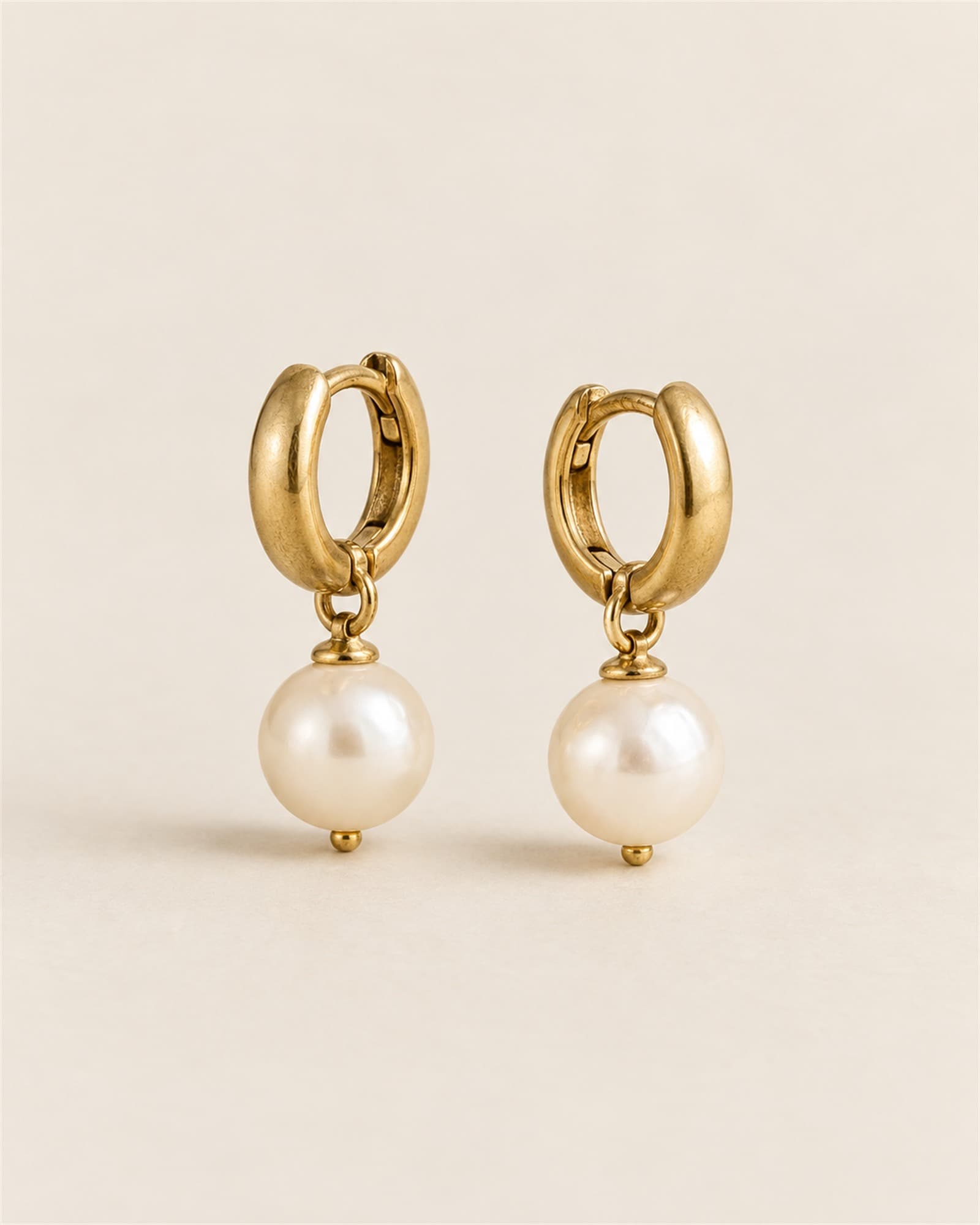 Moti Pearl Huggies — full view on ivory sweep